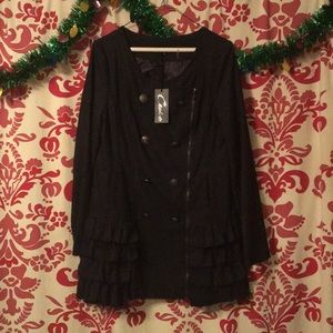 Black top with ruffle bottom for leggings unzips